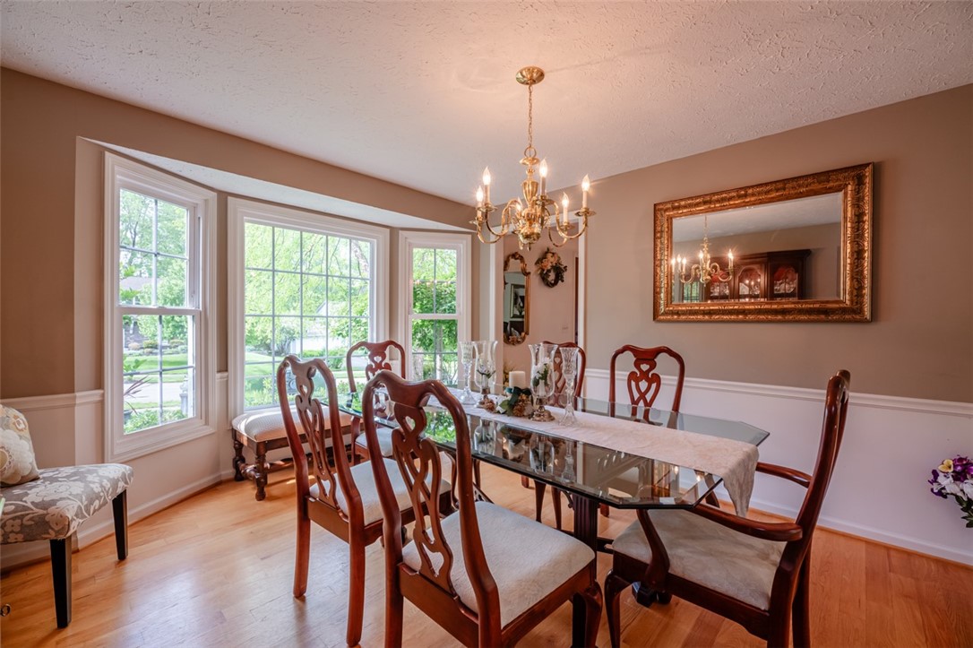 77 Misty Pine Road Perinton, NY 14450 - Photo 9 of 47 THE LARGE FRONT BAY WINDOWS LET LOTS OF SUNLIGHT S