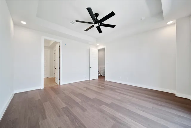 a view of an empty room and wooden floor