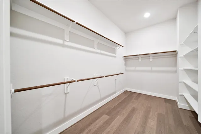 a view of an empty walk in closet