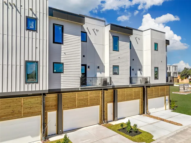 a view of a living room and kitchen with furniture
