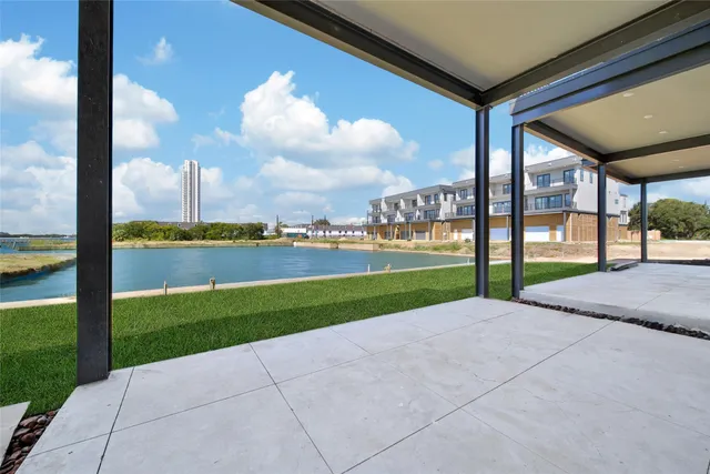 a view of a city street from a roof deck