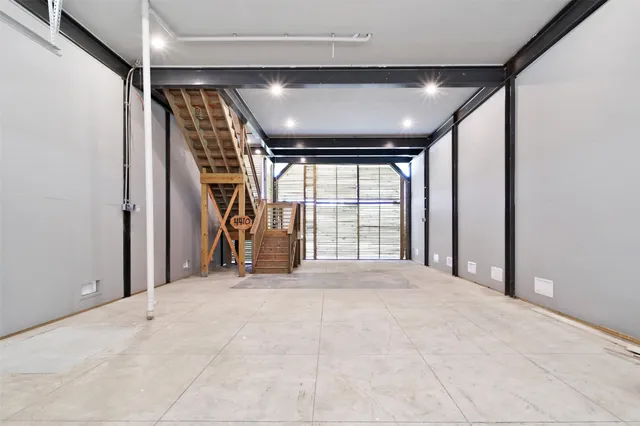 a view of an empty room with windows