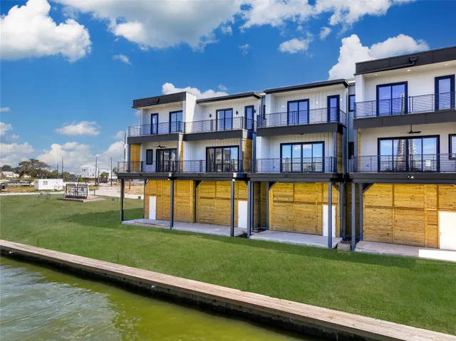 a swimming pool with outdoor seating and yard