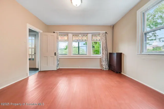 a white toilet sitting next to a shower curtain