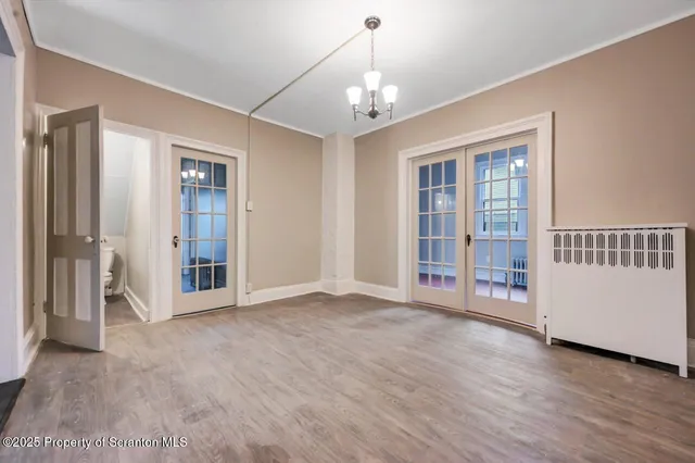 a kitchen with granite countertop a stove a sink and a refrigerator