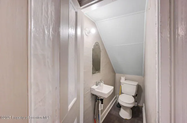 a kitchen with granite countertop white cabinets and stainless steel appliances