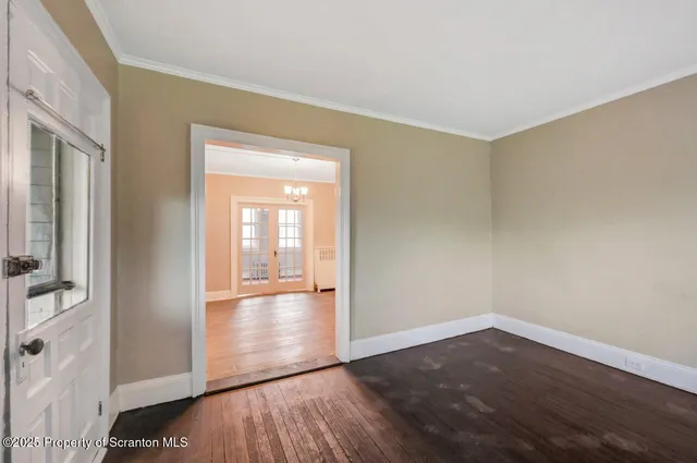 a view of hallway with wooden floor