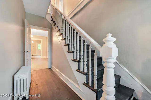 a bathroom with a bathtub and a window