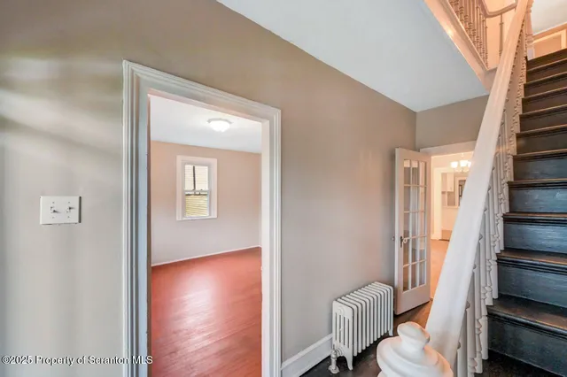 a bathroom with a toilet a sink and a mirror