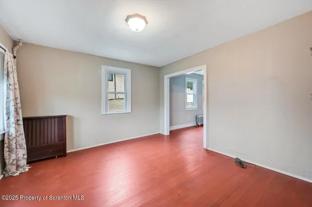 a view of an entryway with wooden floor