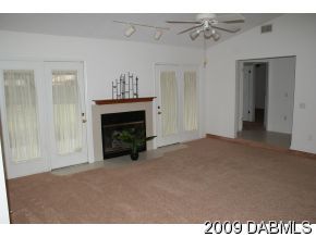 2671 Spring Court DeLand, FL 32720 - Photo 2 of 11 a view of empty room with a fireplace