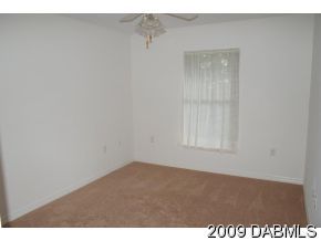 2671 Spring Court DeLand, FL 32720 - Photo 8 of 11 a view of an empty room