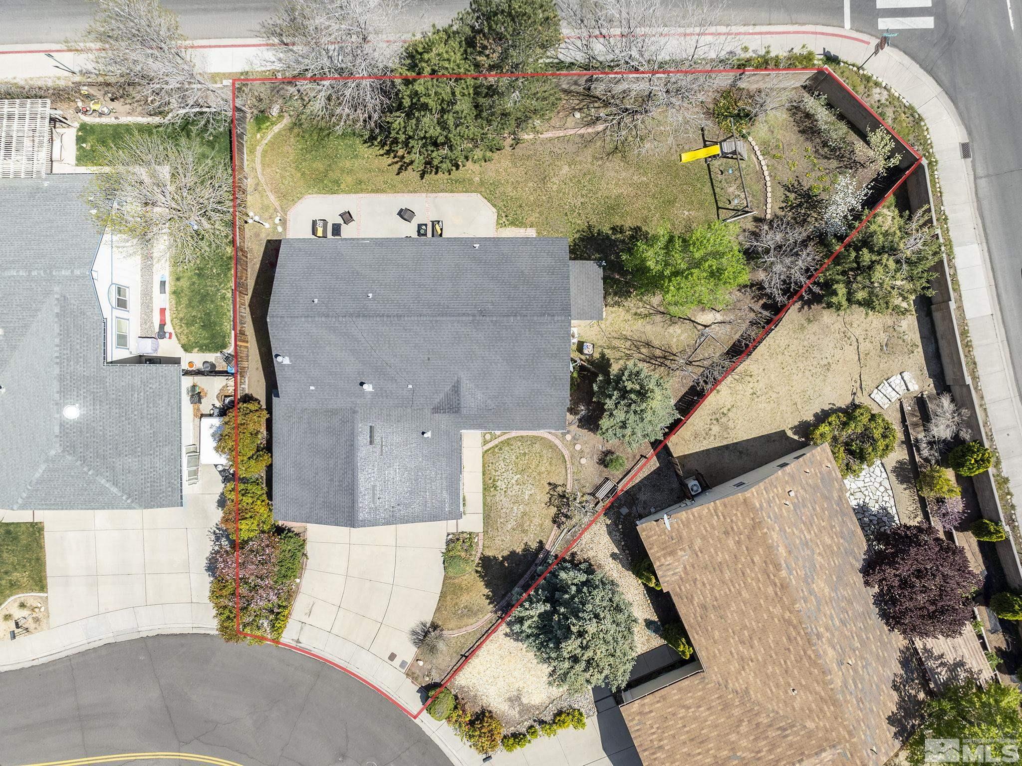 310 Kilborne Avenue Reno, NV 89509 - Photo 23 of 26 an aerial view of a house with a yard and wooden fence