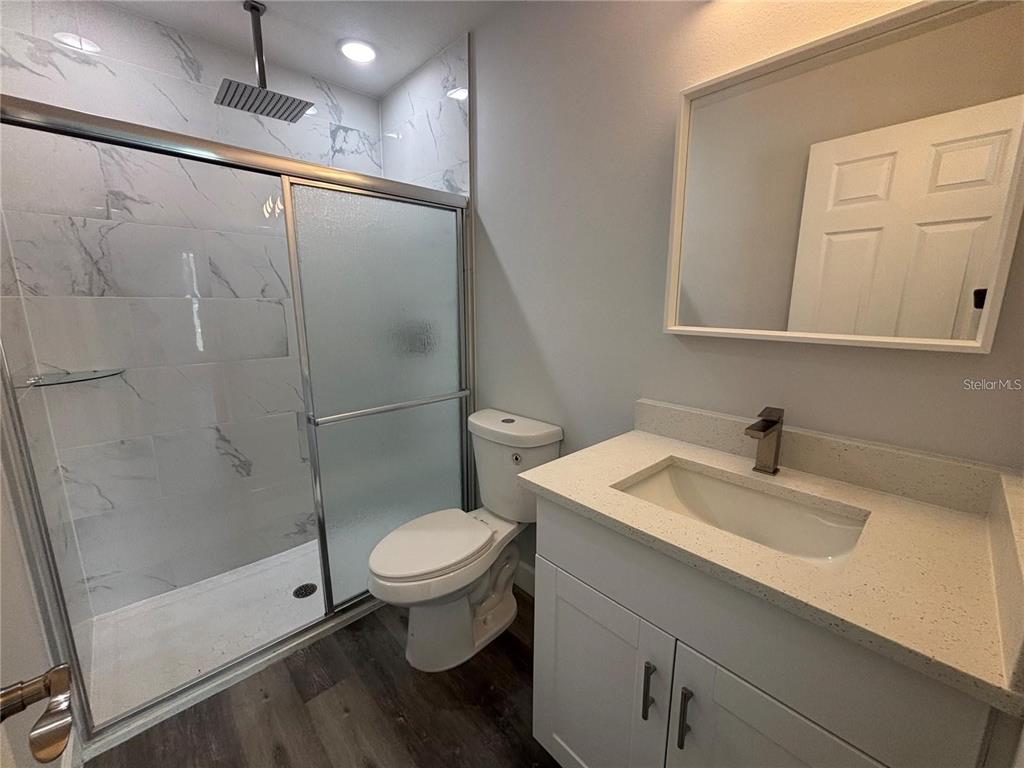 13187 Southwest 103rd Place Dunnellon, FL 34432 - Photo 11 of 49 a bathroom with a sink toilet and shower