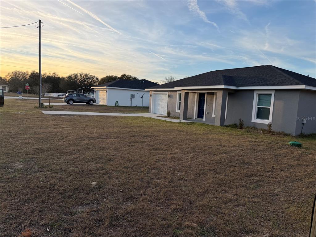 13187 Southwest 103rd Place Dunnellon, FL 34432 - Photo 28 of 49 a view of a house with a yard
