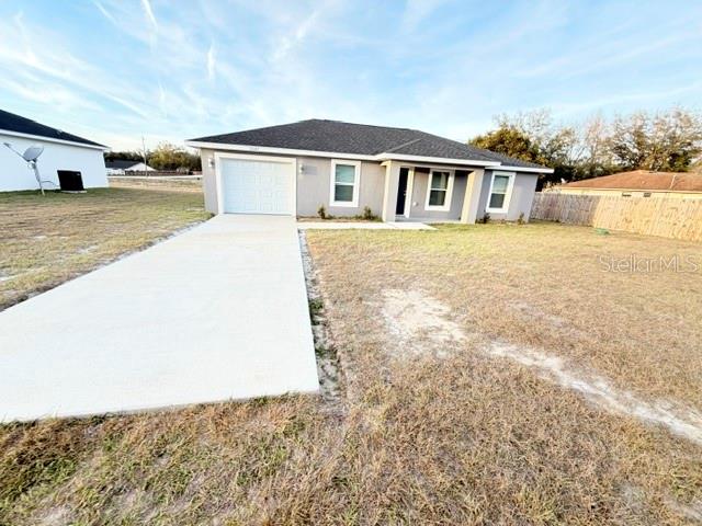 13187 Southwest 103rd Place Dunnellon, FL 34432 - Photo 31 of 49 a view of a house with backyard and ocean