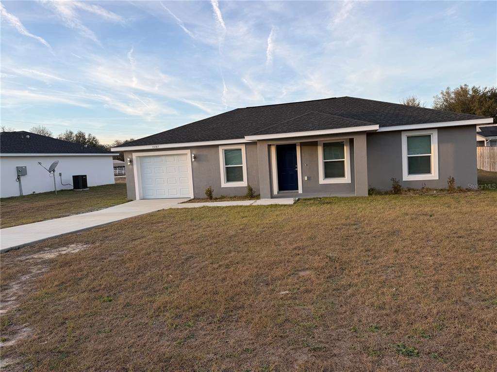 13187 Southwest 103rd Place Dunnellon, FL 34432 - Photo 47 of 49 front view of a house with a yard