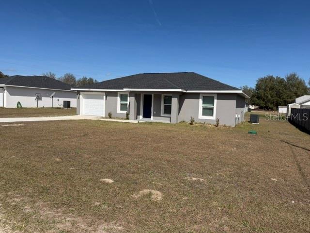 13187 Southwest 103rd Place Dunnellon, FL 34432 - Photo 48 of 49 a front view of a house with a yard