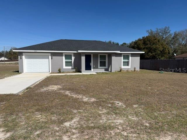 13187 Southwest 103rd Place Dunnellon, FL 34432 - Photo 49 of 49 front view of a house with a yard