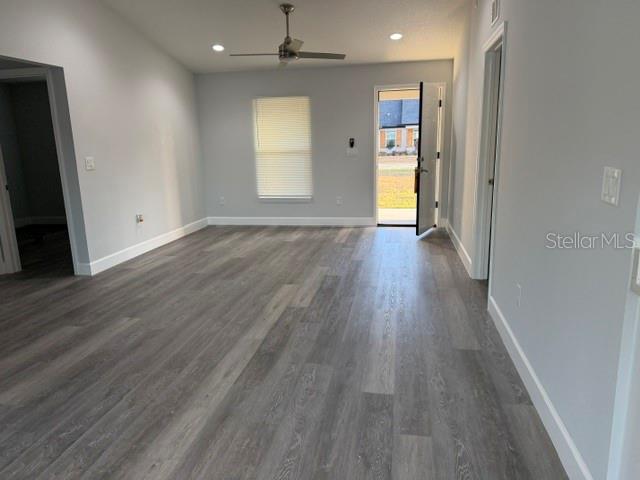 13187 Southwest 103rd Place Dunnellon, FL 34432 - Photo 9 of 49 an empty room with wooden floor and windows