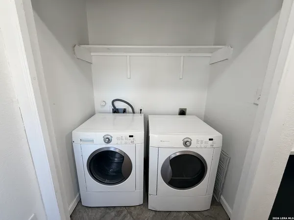 a utility room with dryer and washer