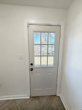 a view of an empty room with a window