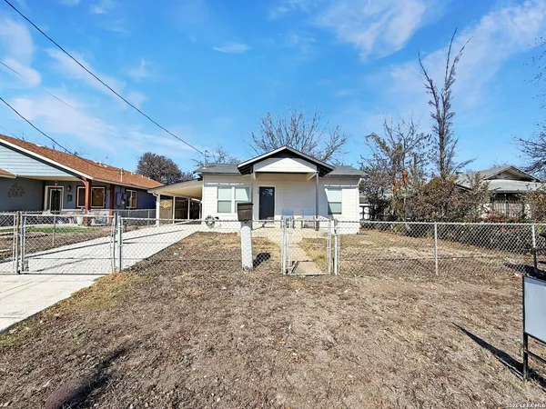 a house with trees in the background