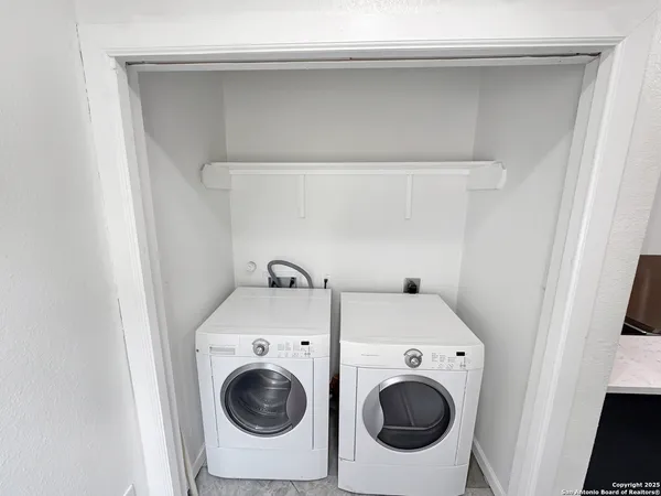 a utility room with dryer and washer