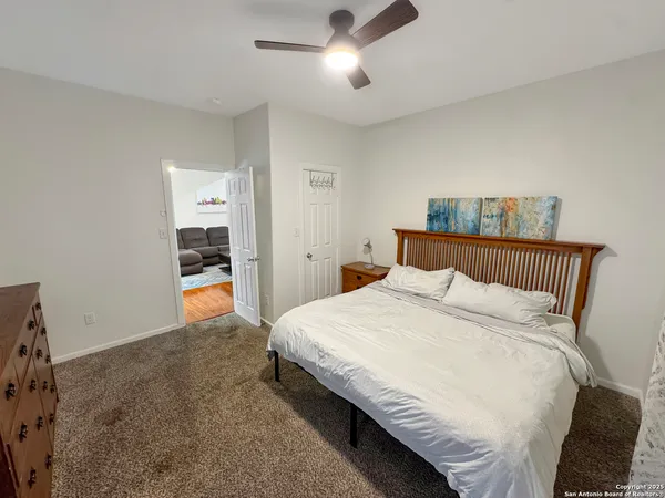 a bedroom with bed and window