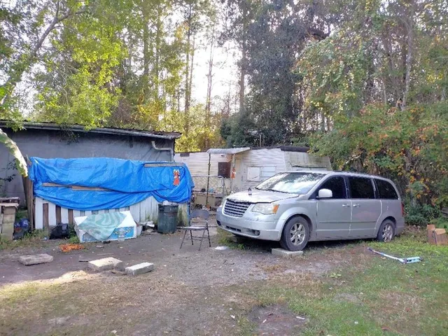 a front view of a house with parking space