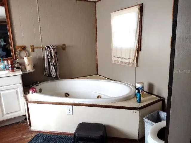 a bathroom with a sink and mirror