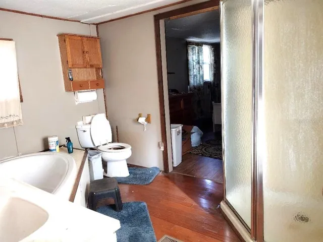 a living room with furniture and a toilet