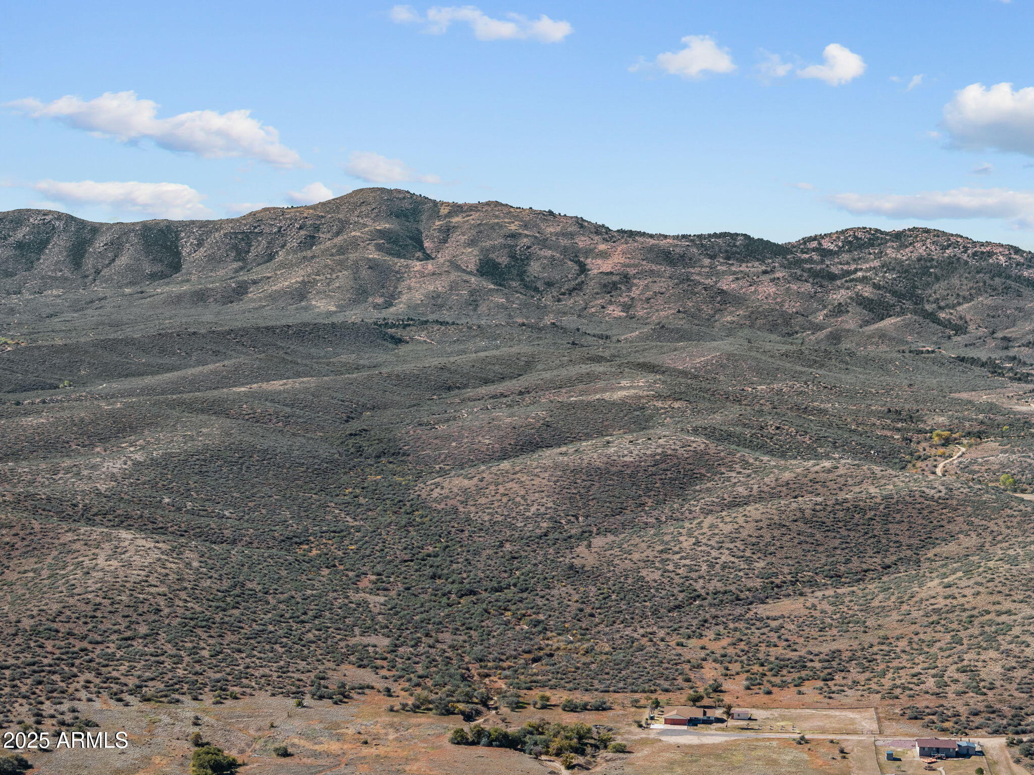 88.1-acres Sickles Ranch Road Kirkland, AZ 86332 - Photo 4 of 20 a view of a dry yard with mountains in the background