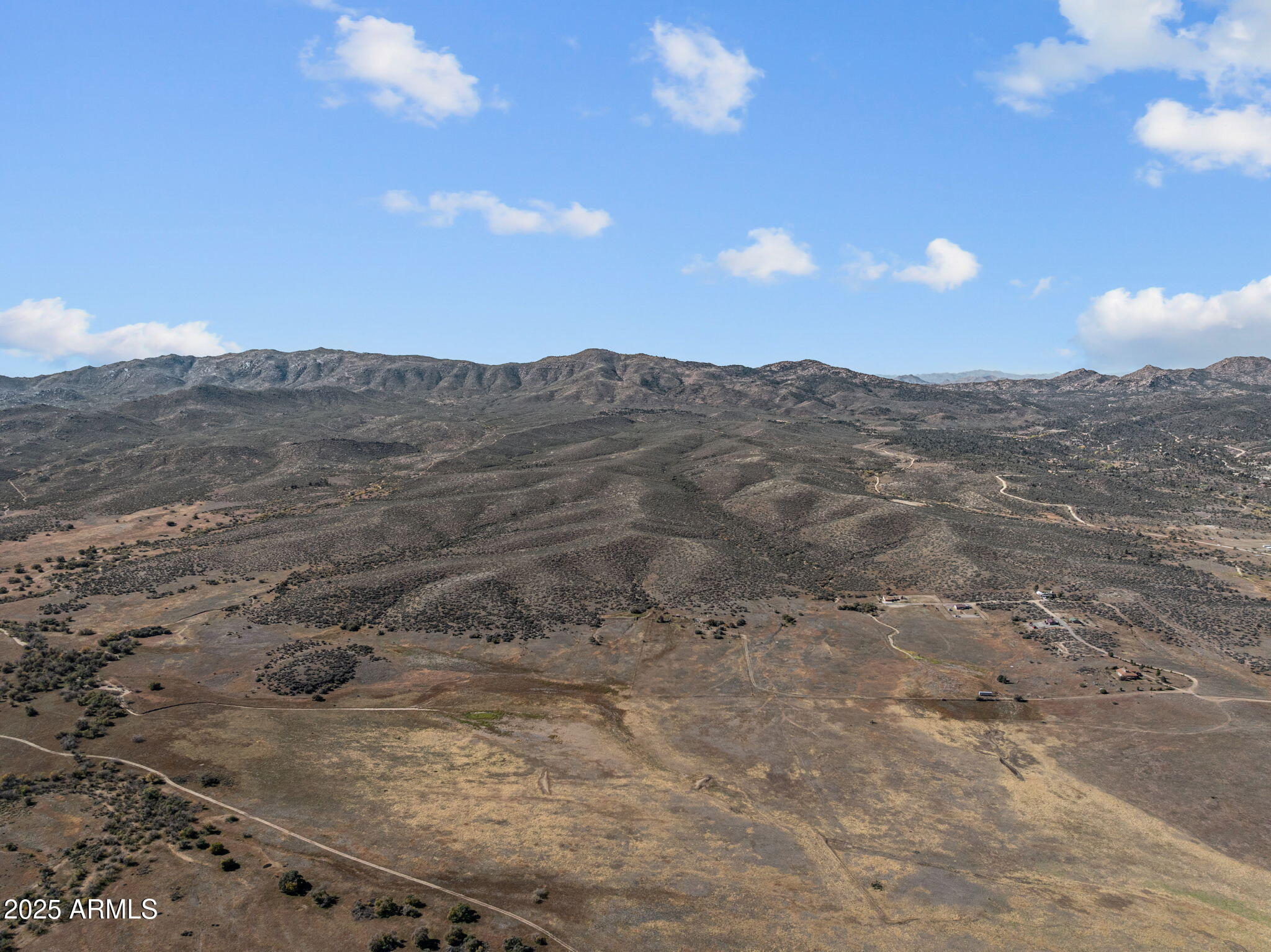88.1-acres Sickles Ranch Road Kirkland, AZ 86332 - Photo 5 of 20 a view of a dry yard with mountains in the background