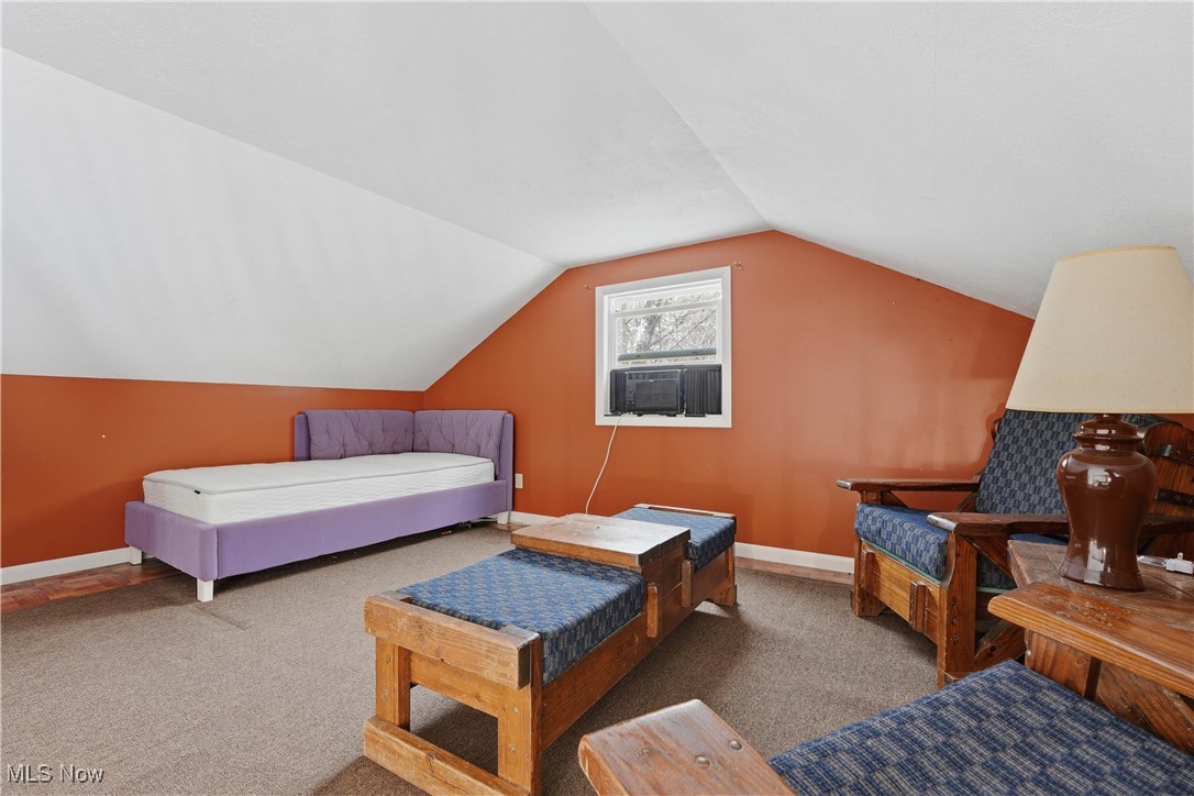 4254 Doral Road Southwest Carrollton, OH 44615 - Photo 35 of 46 Carpeted bedroom with vaulted ceiling and baseboards