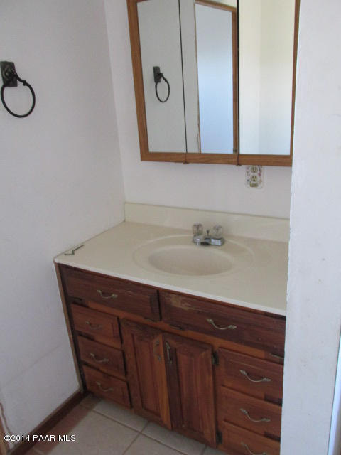 25700 North Reed Road Paulden, AZ 86334 - Photo 3 of 29 a bathroom with a sink and a mirror