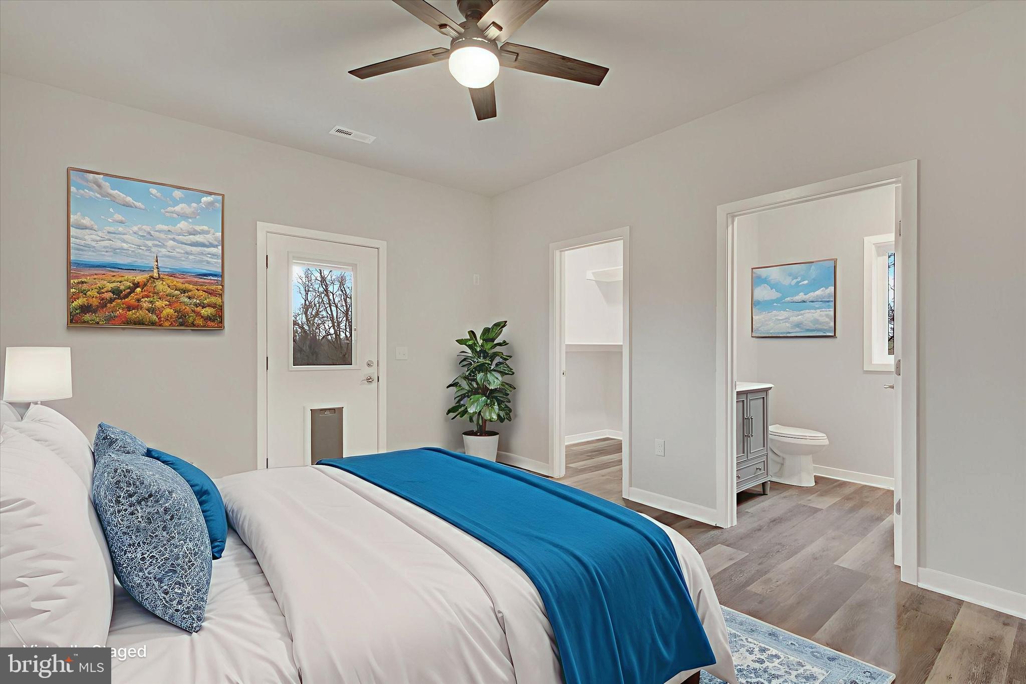 2 Pecan Trail Fairfield, PA 17320 - Photo 15 of 45 a bedroom with a large bed and a chandelier