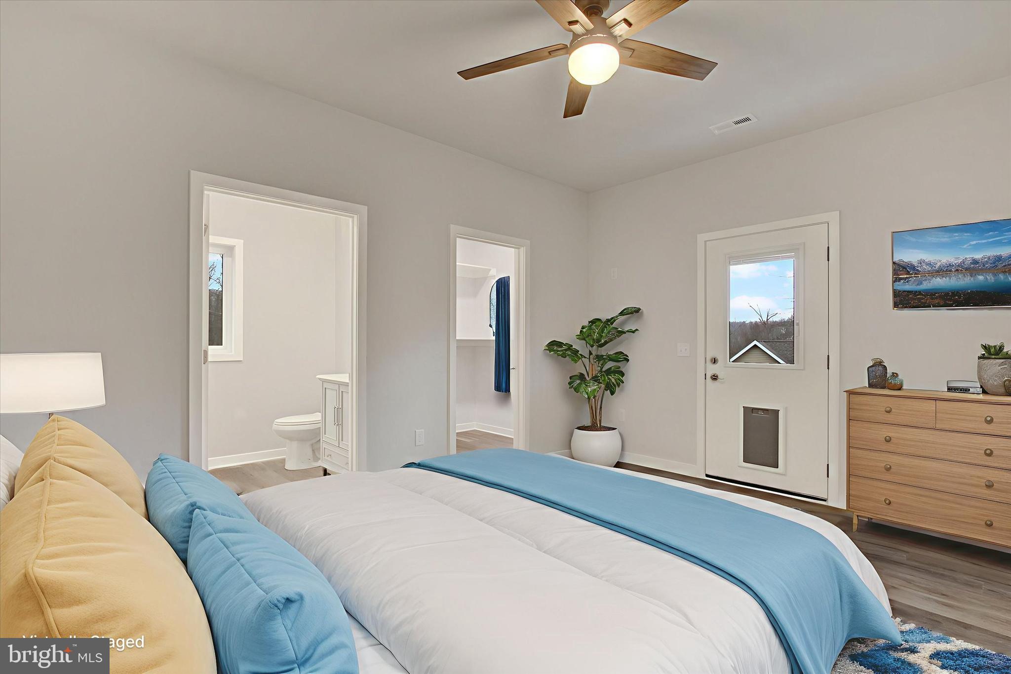 2 Pecan Trail Fairfield, PA 17320 - Photo 20 of 45 a bedroom with a large bed and a chandelier