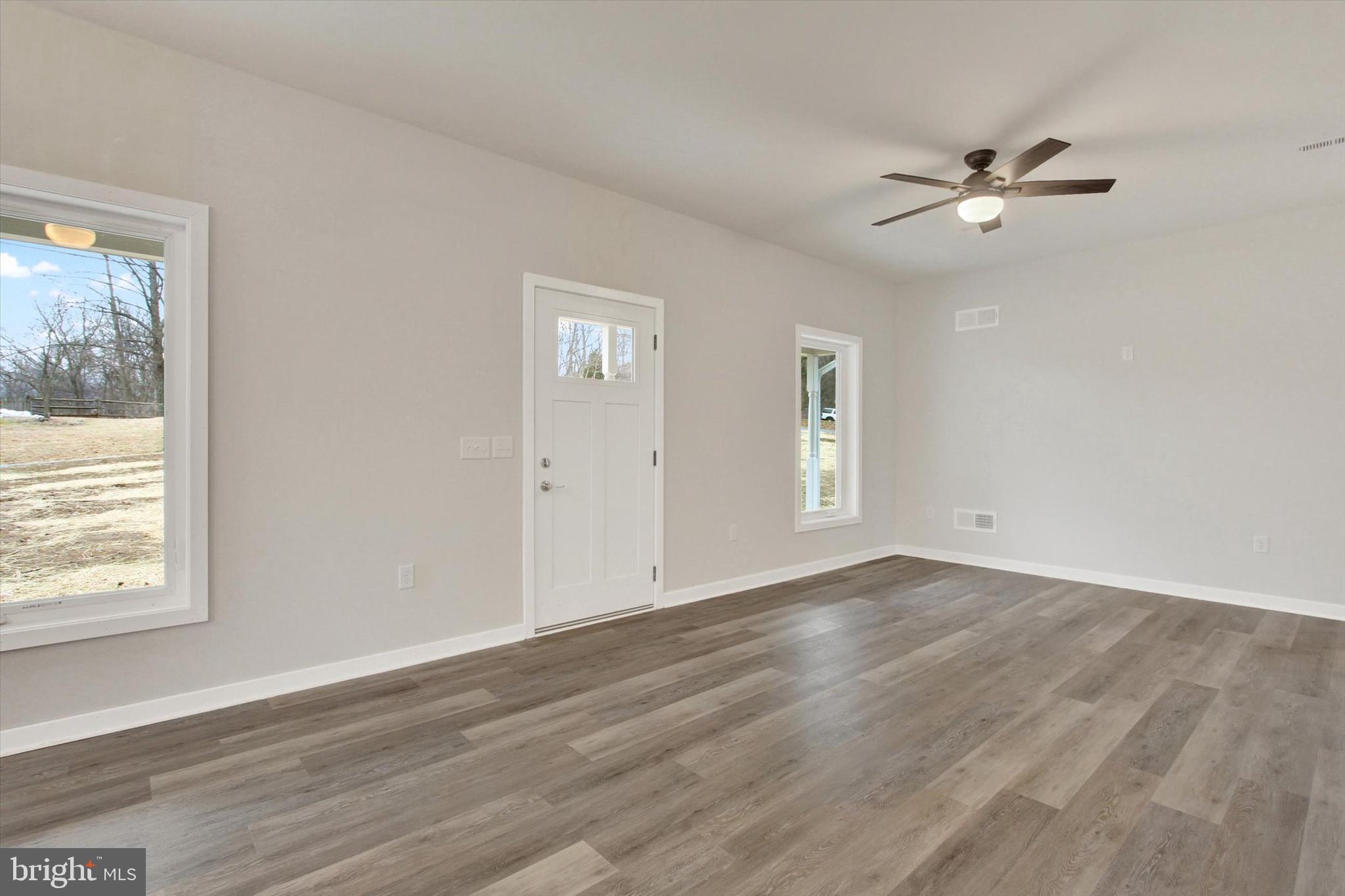 2 Pecan Trail Fairfield, PA 17320 - Photo 4 of 45 a view of an empty room with wooden floor and a window