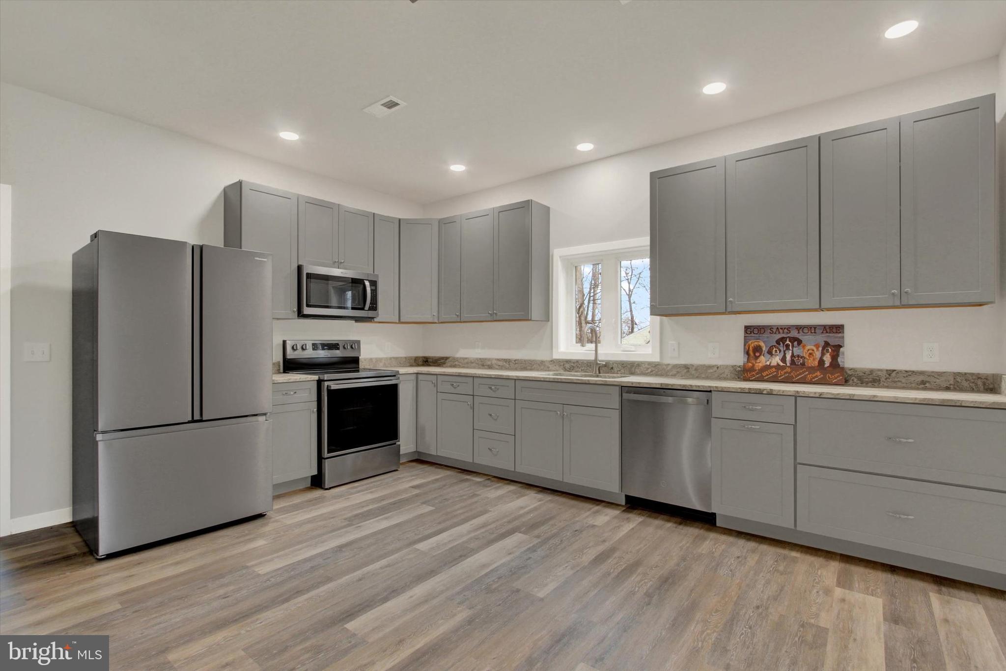 2 Pecan Trail Fairfield, PA 17320 - Photo 9 of 45 a kitchen with granite countertop white cabinets and stainless steel appliances