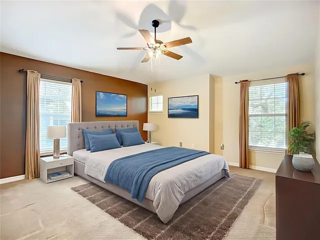 a bedroom with a large bed and a window