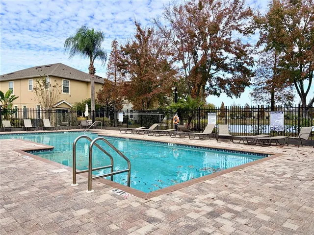 a view of a swimming pool with a lounge chairs
