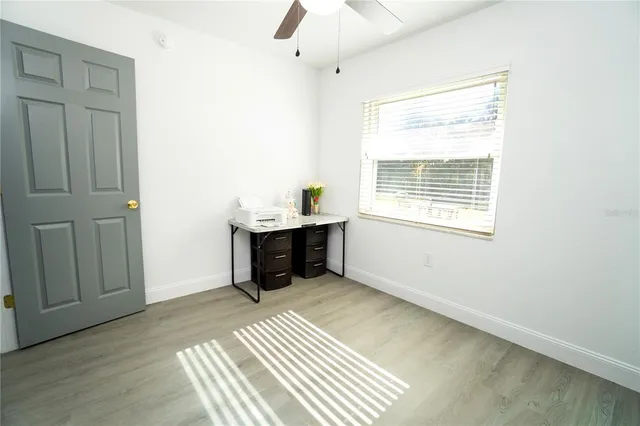 a view of an empty room with a window