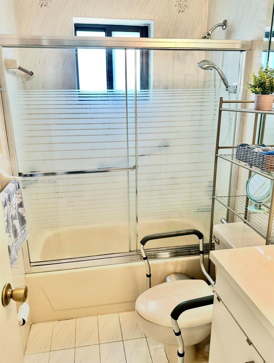 6527 West 22nd Lane Hialeah, FL 33016 - Photo 14 of 18 a bathroom with a toilet sink and shower