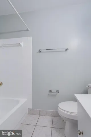 a bathroom with a sink a toilet and bathtub