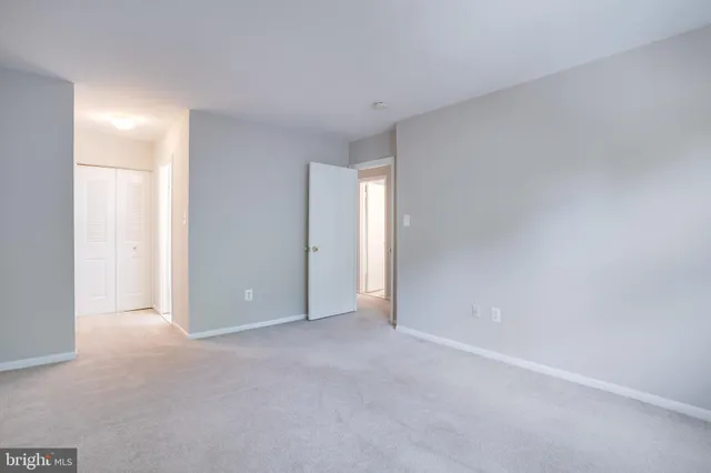 a view of an empty room and a window