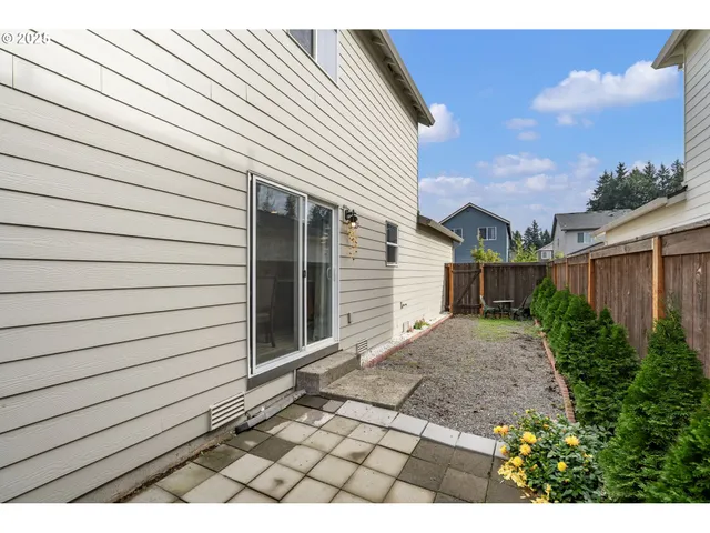 a view of backyard and entertaining space