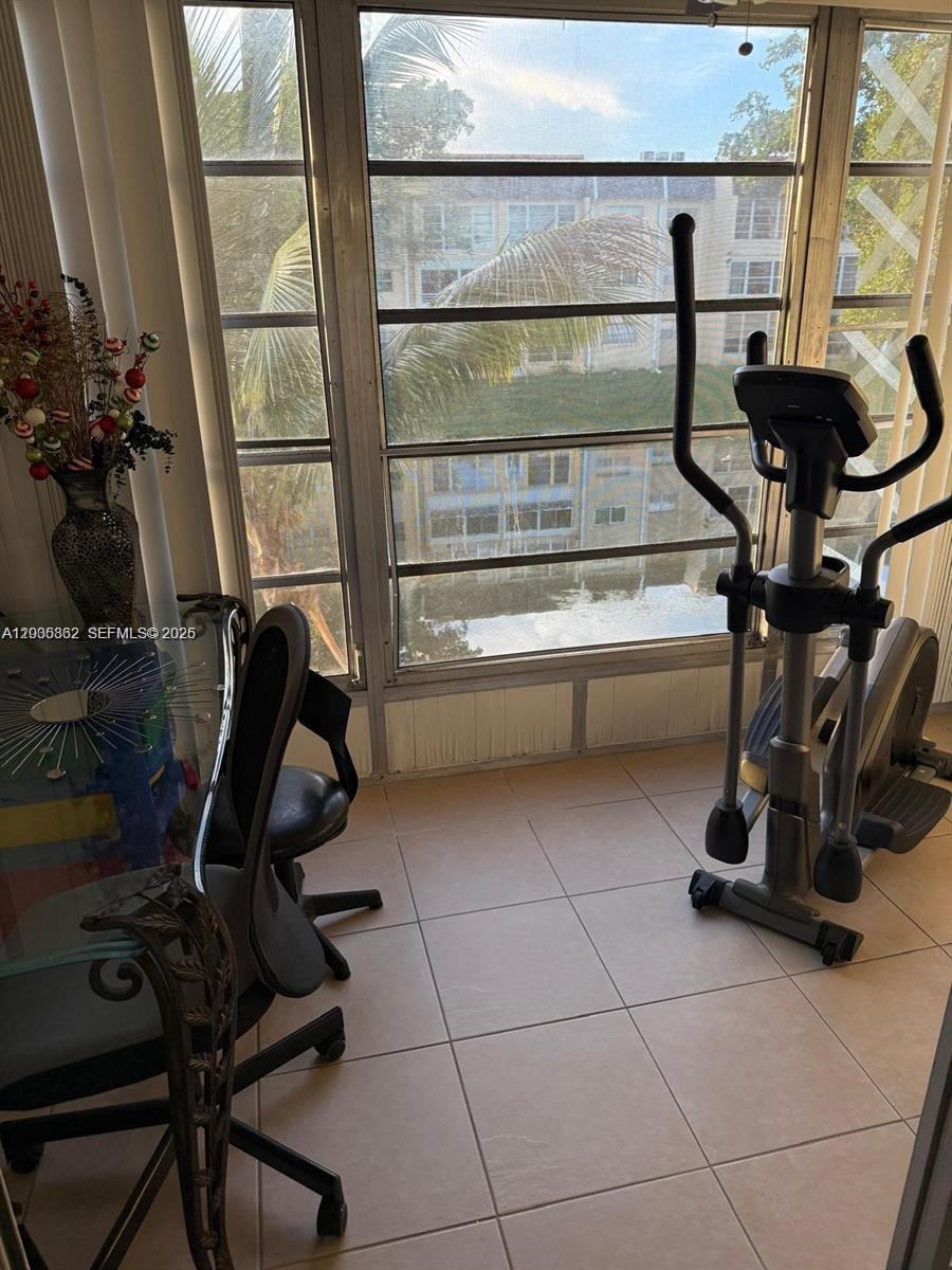 2900 North Pine Island Road, Unit 209 Sunrise, FL 33322 - Photo 3 of 14 a view of a room with gym equipment