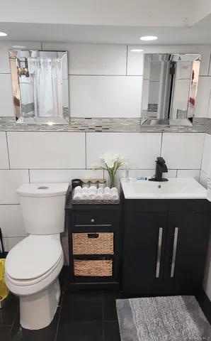 a bathroom with a sink and a toilet