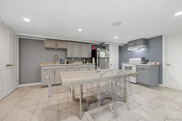 a kitchen with appliances cabinets and a sink
